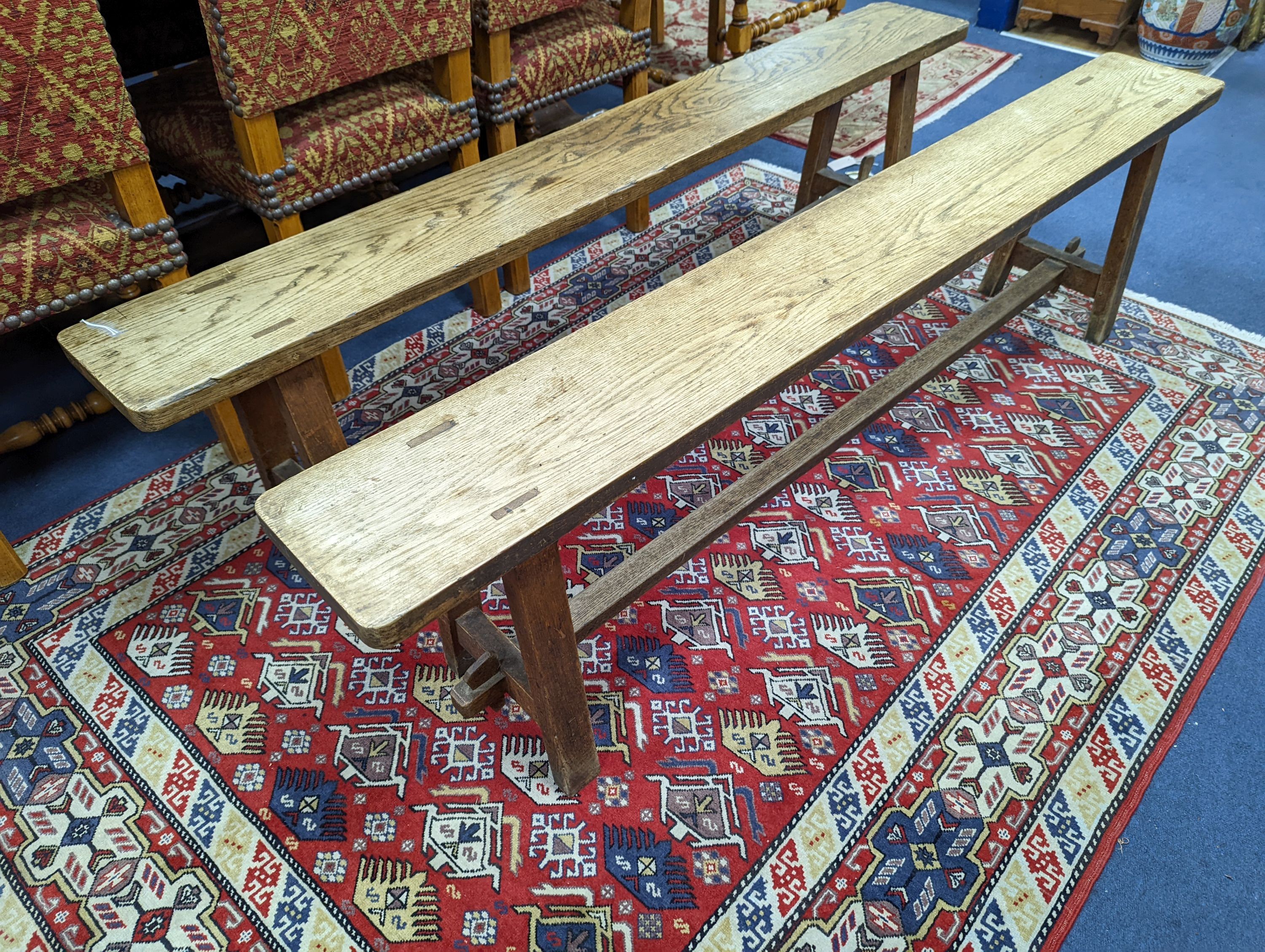 A pair of 19th century French provincial oak bench seats, length 170cm, depth 22cm, height 44cm
